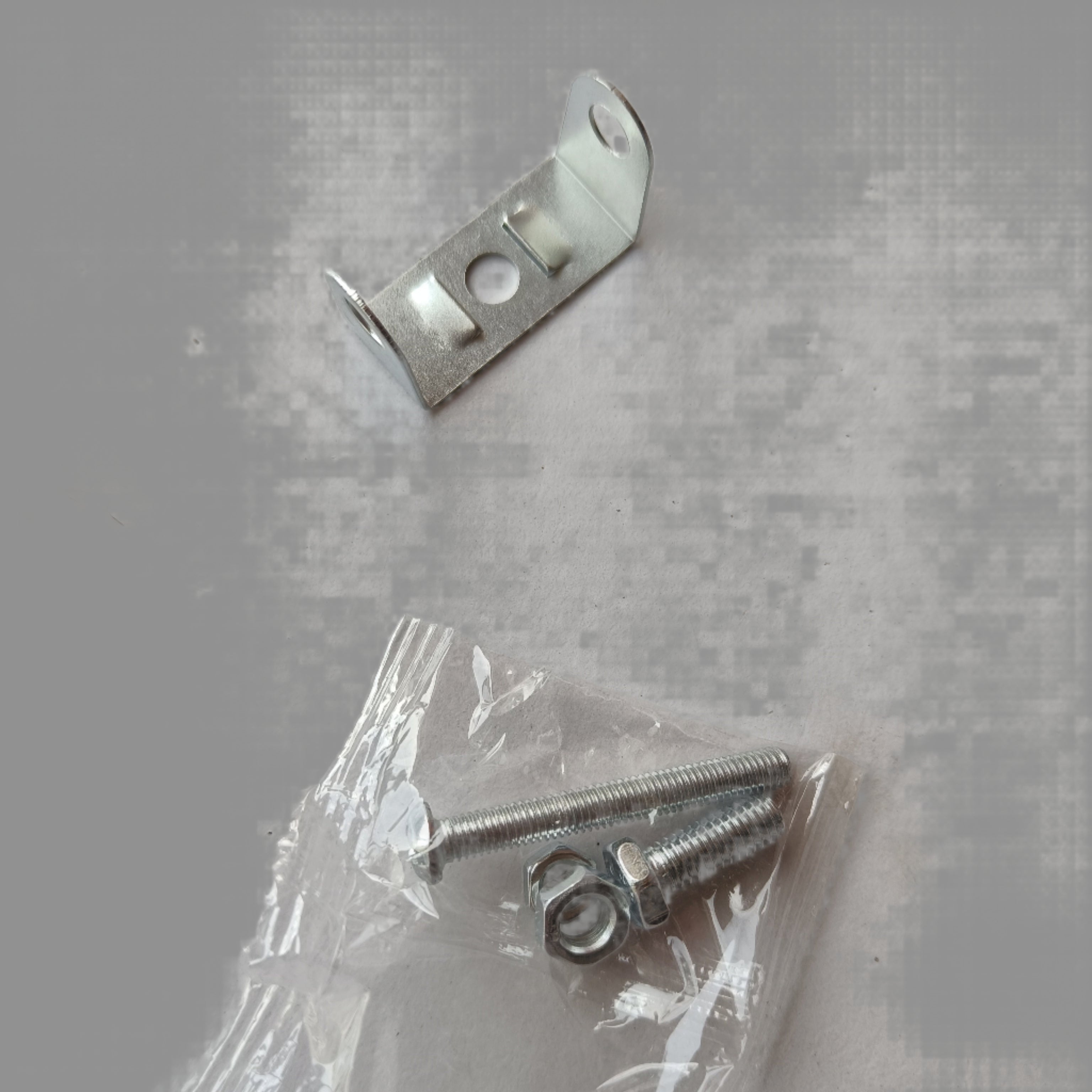 Metal bracket and screws on a white background