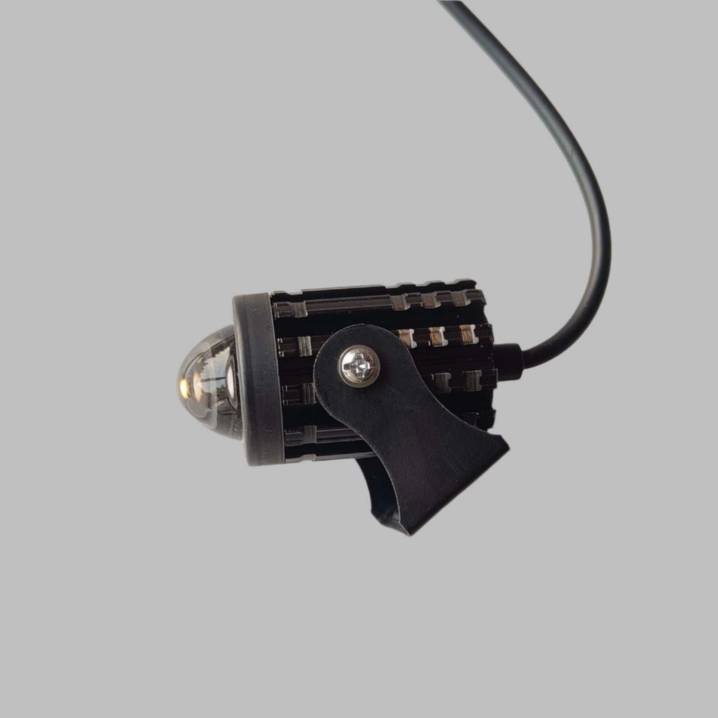 Black clip with a small light on a white background